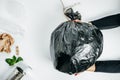 Waste management concept. Woman Hands With garbage on the White