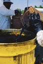 Waste oil poured into barrel