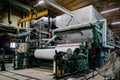 Waste paper recycling plant. Machine for production of paper rolls Royalty Free Stock Photo