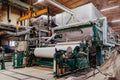 Waste paper recycling plant. Machine for production of paper rolls Royalty Free Stock Photo