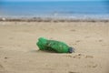 Waste plastic bottle on sand. Garbage on the beach Royalty Free Stock Photo