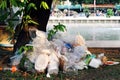 Waste plastic heap, Garbage plastic, Waste dump, Pile plastic bags and wet food waste at the the tree and river background Royalty Free Stock Photo