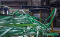 Waste plastic ribbon from automated packaging line Royalty Free Stock Photo