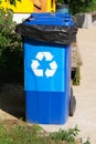 Waste recycling concept. Blue containers for further processing of garbage. Garbage collection. Vertical image Royalty Free Stock Photo
