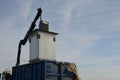 Waste recycling in separated waste containers. the bottom lid opens when the crane is pulled over the body of the truck, the raw m