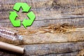 waste recycling symbol with garbage on wooden background top view mock-up Royalty Free Stock Photo