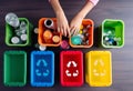 waste segregation in colored containers at home. top view