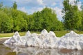Waste snow from the ice palace in park in Royalty Free Stock Photo