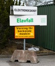 Waste sorting at SRV recycling center in Salem, sign with electrical waste. electronic scrap and sign with text: warning of a reve