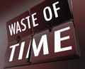 Waste of Time Words Flipping Tile Clock Inefficient Lost Effort Royalty Free Stock Photo