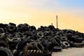 Waste tires and tyres at landfill for recycling. Regenerated tire rubber produced. Reuse of the waste rubber tyres. Pile of old