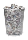 Wastebasket full of crumpled paper over white background