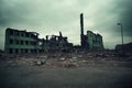 Wasteland with collapsed structures of old factory and destroyed industrial buildings.