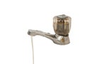 Wasting water - Water drop from old water tap isolated Royalty Free Stock Photo
