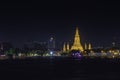 Wat Arun at night with gold and is the oldest temple of the Chao Phraya River. in Bangkok Thailand