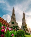 Wat Arun Ratchawararam with beautiful blue sky and white clouds. Wat Arun buddhist temple is the landmark in Bangkok, Thailand. Royalty Free Stock Photo