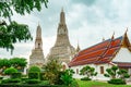 Wat Arun Ratchawararam with beautiful blue sky and white clouds. Wat Arun buddhist temple is the landmark in Bangkok, Thailand. Royalty Free Stock Photo
