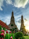 Wat Arun Ratchawararam with beautiful blue sky and white clouds. Wat Arun buddhist temple is the landmark in Bangkok, Thailand. Royalty Free Stock Photo
