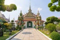 Wat Arun Ratchawararam of giants front of the church and nobody in front Entrance door buddhist temple of tourists and landmark