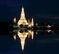 Wat Arun Ratchawararam Ratchawaramahawihan Temple of Dawn at night reflection Bangkok, Thailand