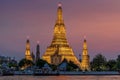 Wat Arun stupa, a significant landmark of Bangkok, Thailand, stands prominently along the Chao Phraya River, with a beautiful Royalty Free Stock Photo