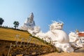 Rimkok district,Chiang Rai Province,Northern Thailand on January 19,2020:Enormous white Guan Yin Statue and beautiful dragon
