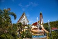 Wat Khao Sung Chaem Fa temple with giant snake and reclining gold buddha, in Kanchanaburi, Thailand