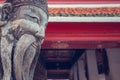 Wat Pho smiling chinese monk stone statue. Bangkok, Thailand.