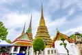 Wat Pho temple in Bangkok city, Thailand. View of pagoda and stupa in famous ancient temple. Religious buildings in buddhism style Royalty Free Stock Photo