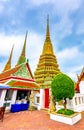 Wat Pho temple in Bangkok city, Thailand. View of pagoda and stupa in famous ancient temple. Religious buildings in buddhism style Royalty Free Stock Photo