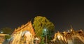 Wat Phra Chetuphon or Wat Pho, a Buddhist temple illuminated at night in Bangkok City, Thailand. Thai architecture buildings Royalty Free Stock Photo