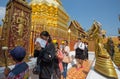 Wat Phra That Doi Suthep Temple, Chiang Mai, Thailand. Faithful buddhists pray in the temple.