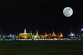 Wat pra kaew Public Temple Grand palace with super moon at night, Bangkok Thailand Royalty Free Stock Photo