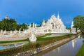 Wat Rong Khun The White Abstract Temple and pond with fish, in Chiang Rai, Thailand