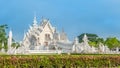 Wat Rong Khun The White Abstract Temple and pond with fish, in Chiang Rai, Thailand. Popular and famous