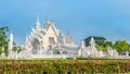 Wat Rong Khun The White Abstract Temple and pond with fish, in Chiang Rai, Thailand.