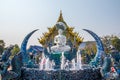 Rimkok district,Chiang Rai Province,Northern Thailand on January 19,2020:The fountain,white Buddha statue and angellic guardians