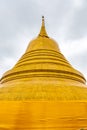 Wat Saket temple with golden stupa and angel statue. Symbol of buddhism in Bangkok city, Thailand. Majestic and religion symbol of Royalty Free Stock Photo