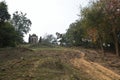 Pathway leading up the hillside to the ruins of Wat Saphan Hin, with its large standing Buddha image in view, Sukhothai, Thailand Royalty Free Stock Photo