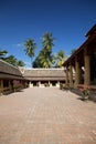 Wat Si Saket, in Vientiane, is surrounded by lush tropical trees.