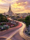 wat sothonwararam with light from a car and sunset Royalty Free Stock Photo