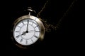 The watch carries an antique bag placed on a black background