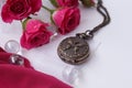 Watch on a chain among the roses Royalty Free Stock Photo