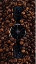 Watch in coffee beans time clock, reflaction, morning, concept Royalty Free Stock Photo