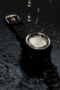 Watch computer for diving in water streams on a black background Royalty Free Stock Photo