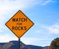 Falling rock sign next to the road Royalty Free Stock Photo