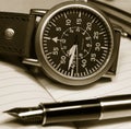 Watch and fountain pen Royalty Free Stock Photo