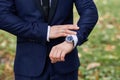 A watch on the groom`s hand