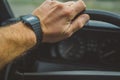 Watch on a hand in a retro car Royalty Free Stock Photo