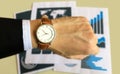 Watch on the left hand of business man  with data report background for business and financial Royalty Free Stock Photo